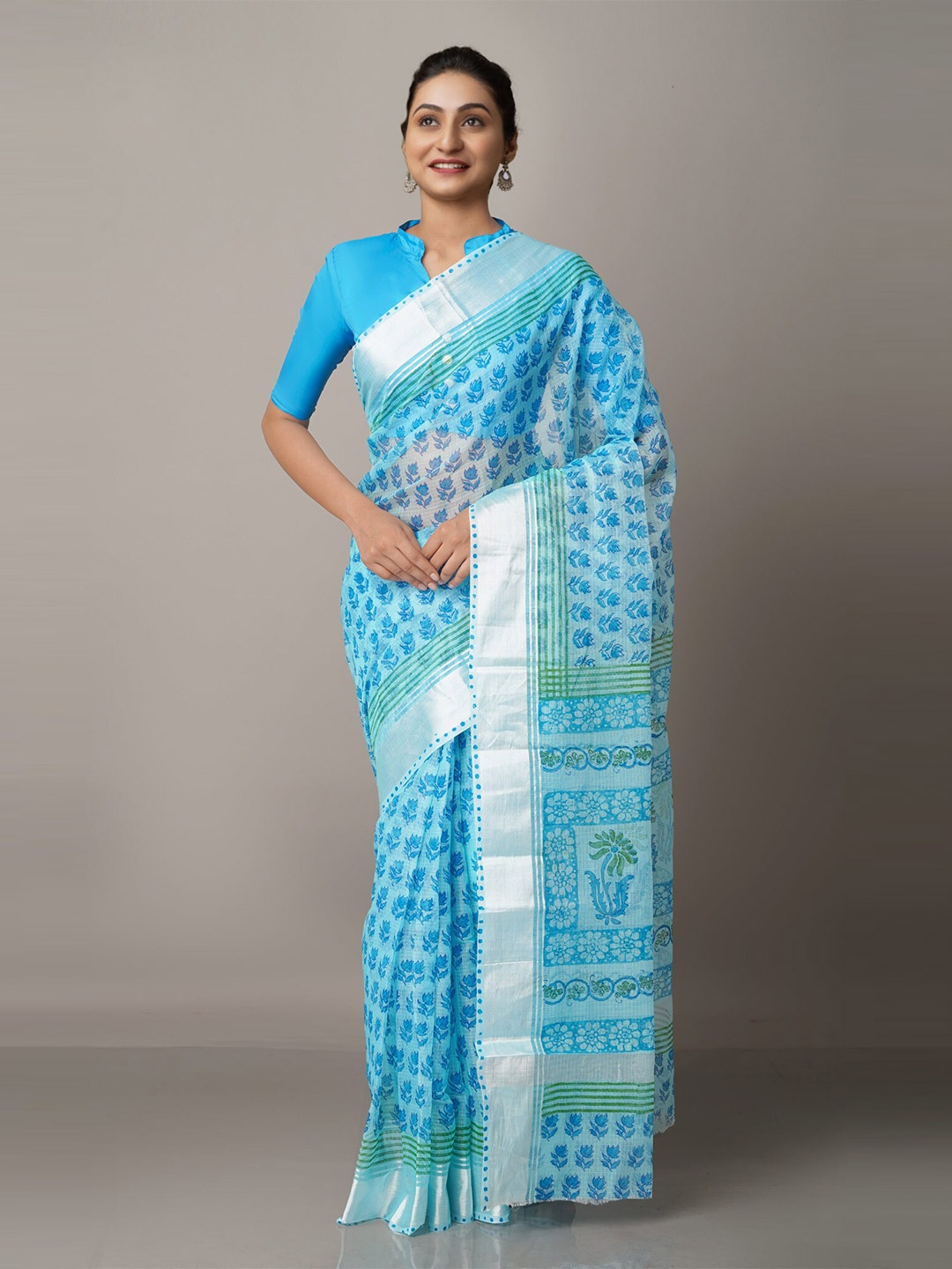 

Unnati Silks Blue & Silver-Toned Floral Printed Zari Pure Cotton Kota Handloom Saree