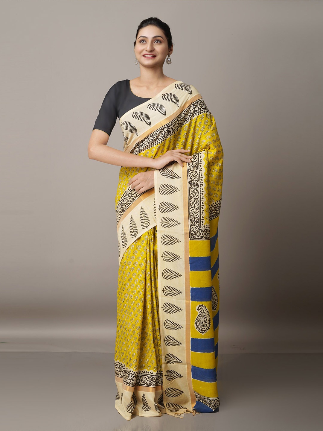 

Unnati Silks Yellow & Gold Printed Zari Silk Blend Bagru Saree