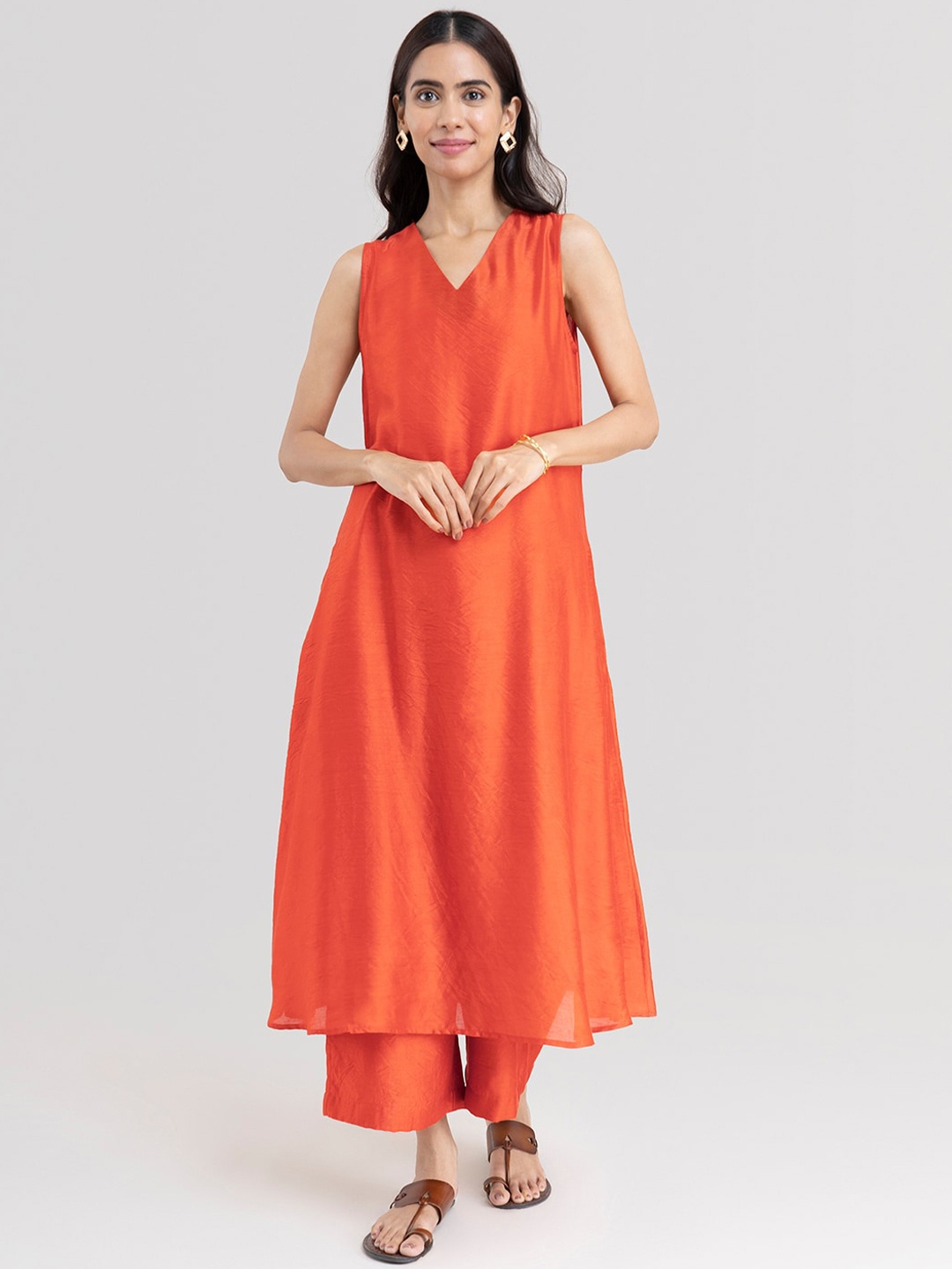 

Pink Fort Women Orange Chanderi Cotton Kurta with Palazzos