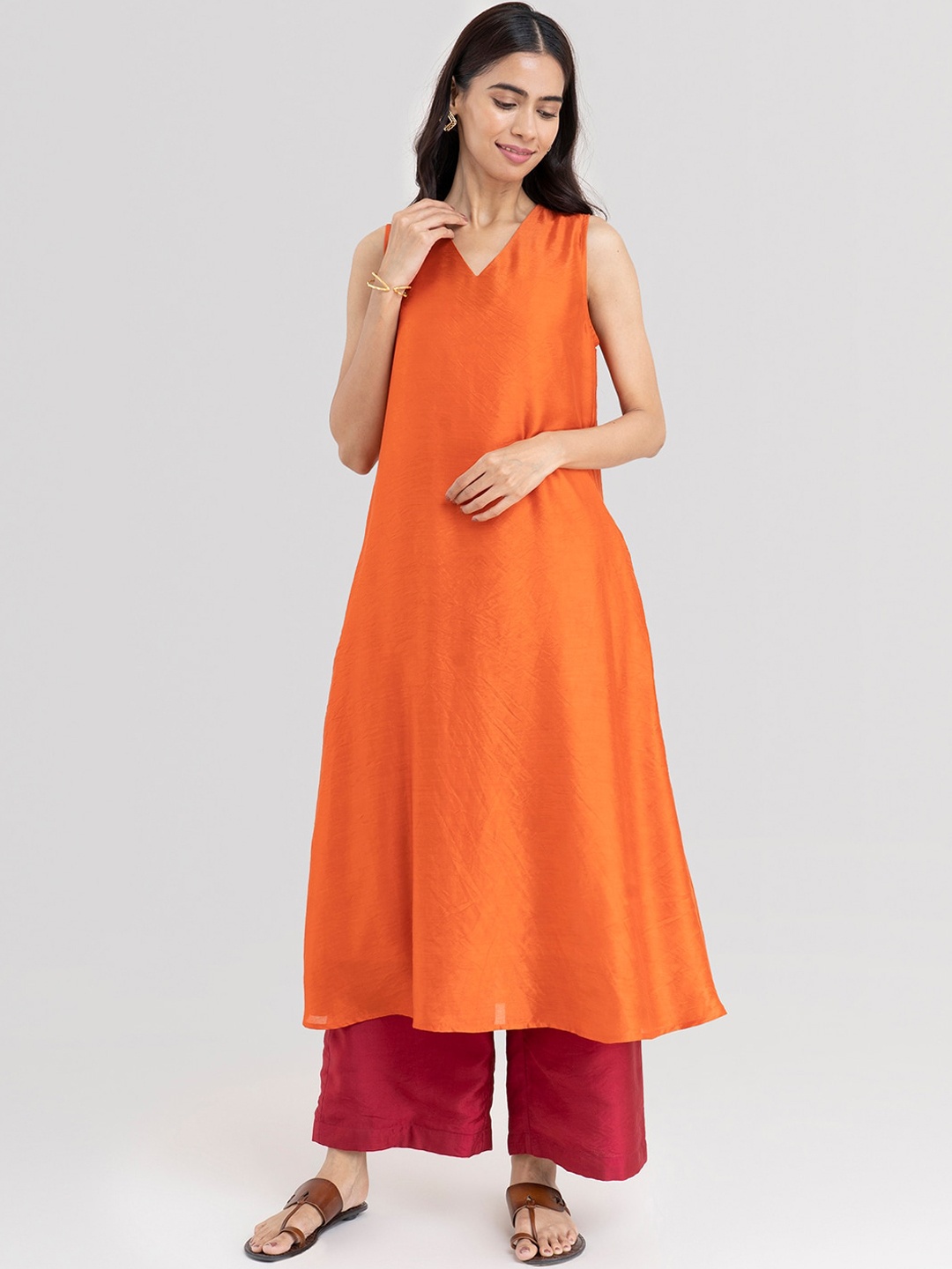 

Pink Fort Women Orange Chanderi Cotton Kurta with Palazzos