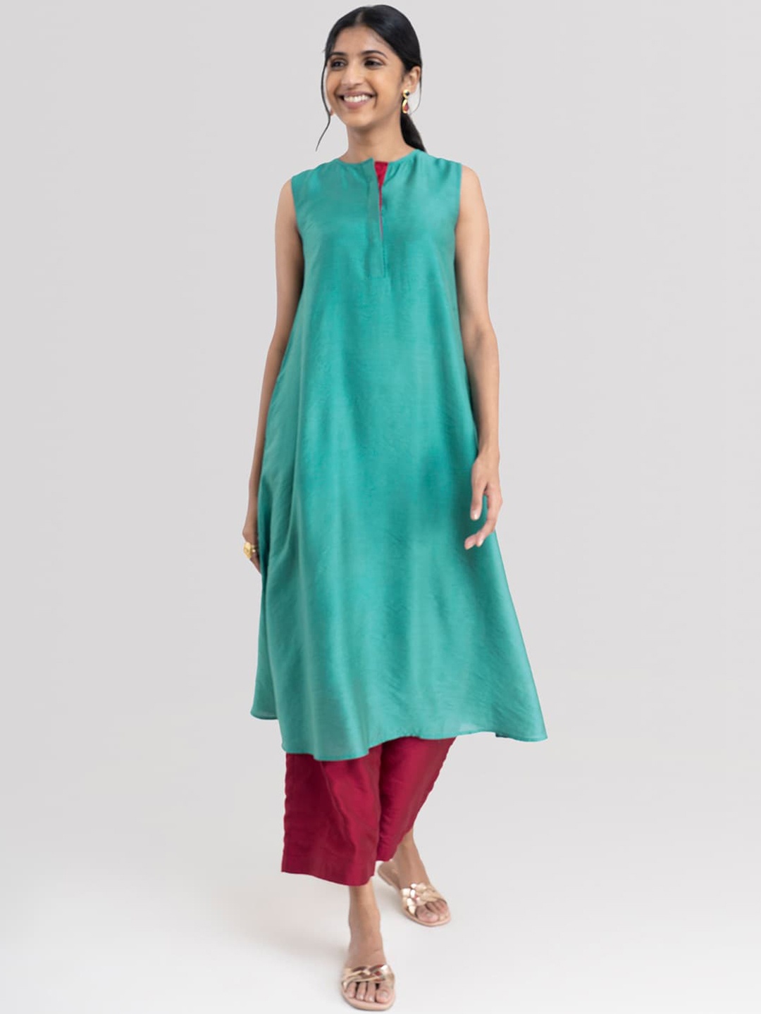 

Pink Fort Women Sea Green Chanderi Cotton Kurta with Palazzo