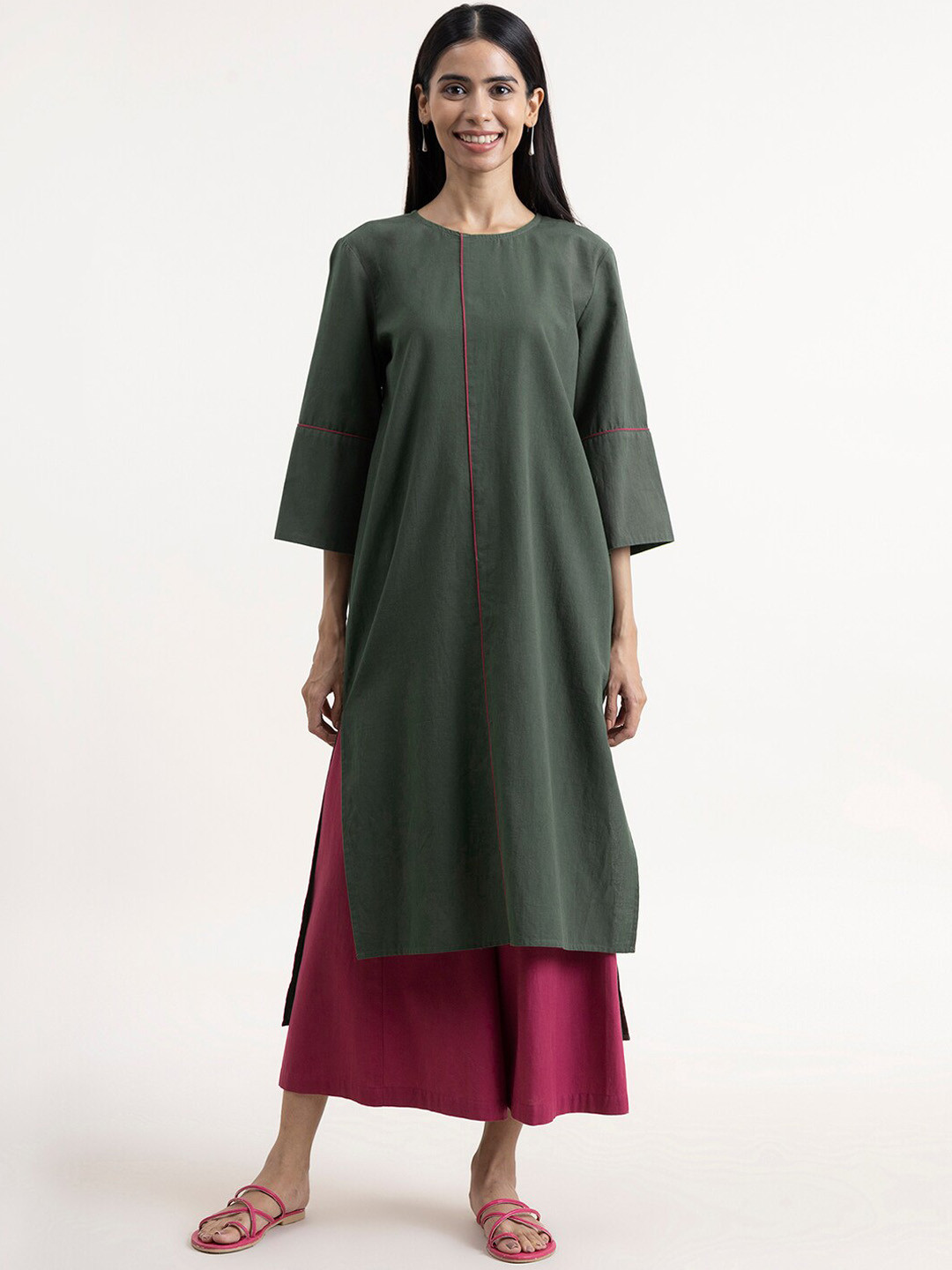 

Pink Fort Women Green Solid Straight Kurta
