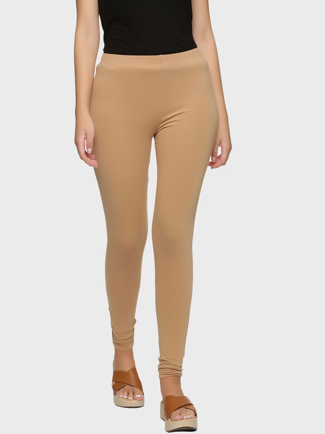 

Outflits Women Beige Solid Skinny Fit Churidar Length Leggings