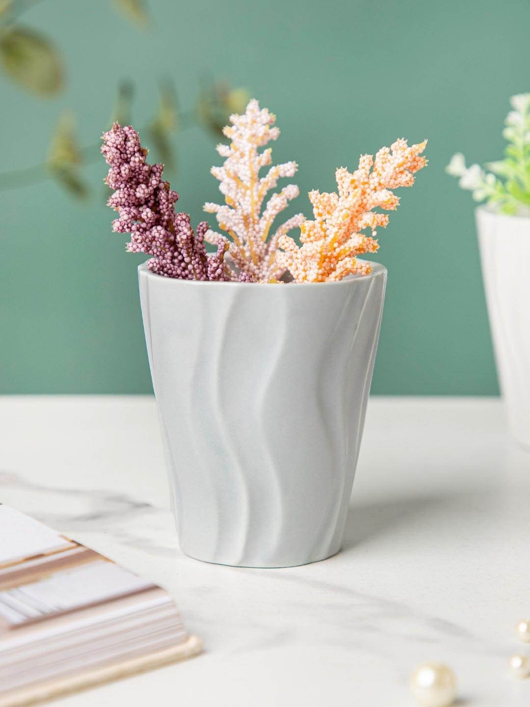 

Nestasia Grey Wavy Textured Ceramic Planters