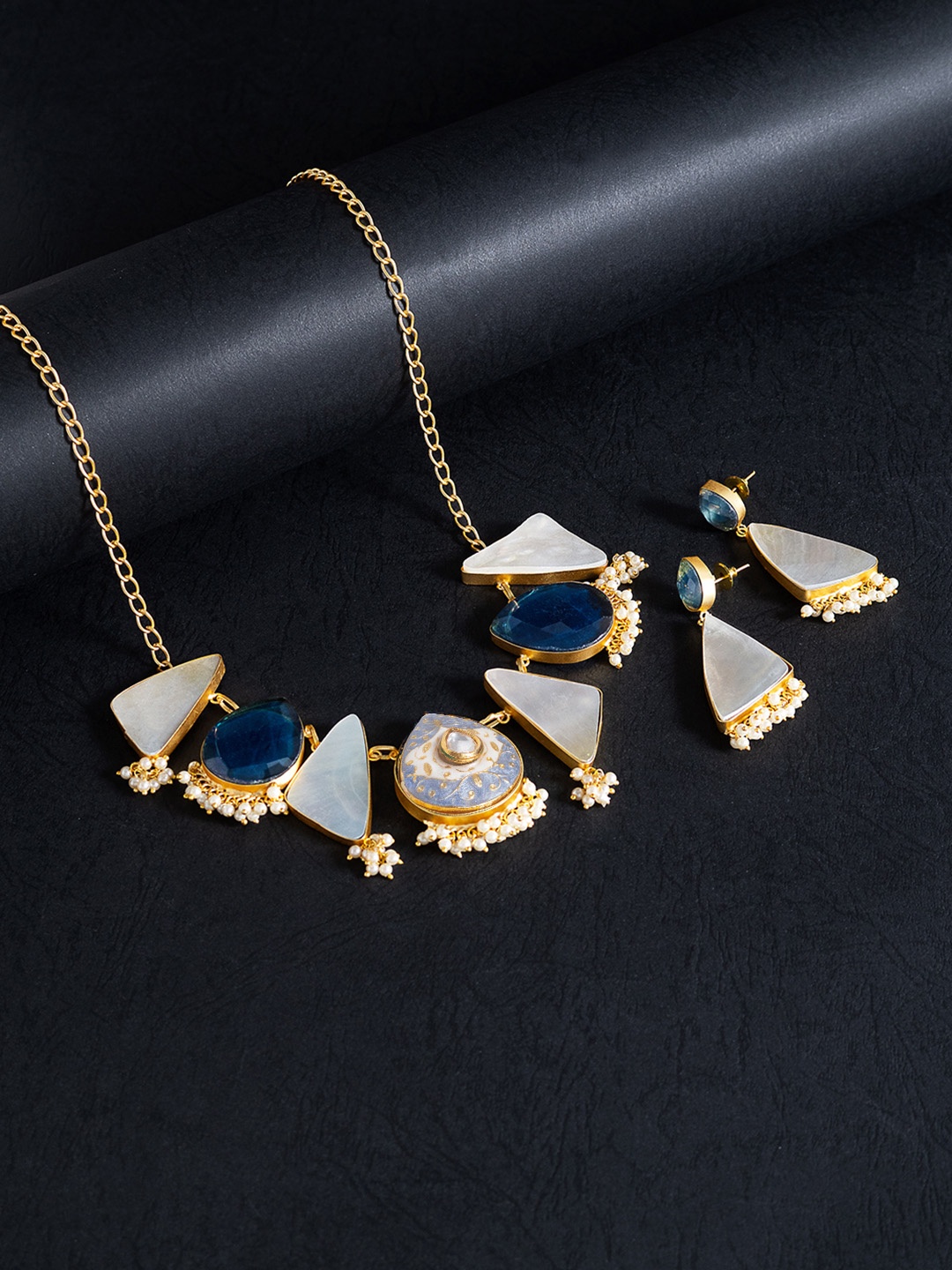 

Golden Peacock Gold-Toned & Off White Mother Of Pearls Stones Studded Jewellery Set