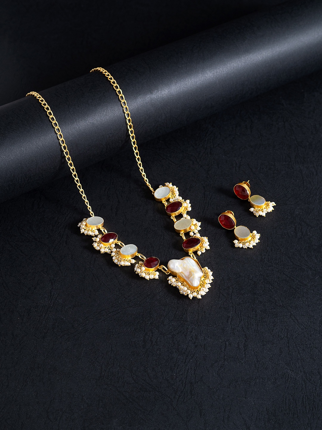 

Golden Peacock Gold-Toned & Maroon Mother Of Pearls Stones Studded Jewellery Set