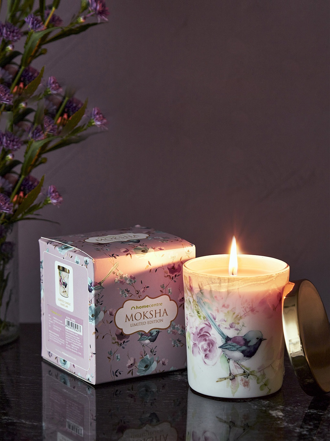 

Home Centre Purple Printed Glass Candle