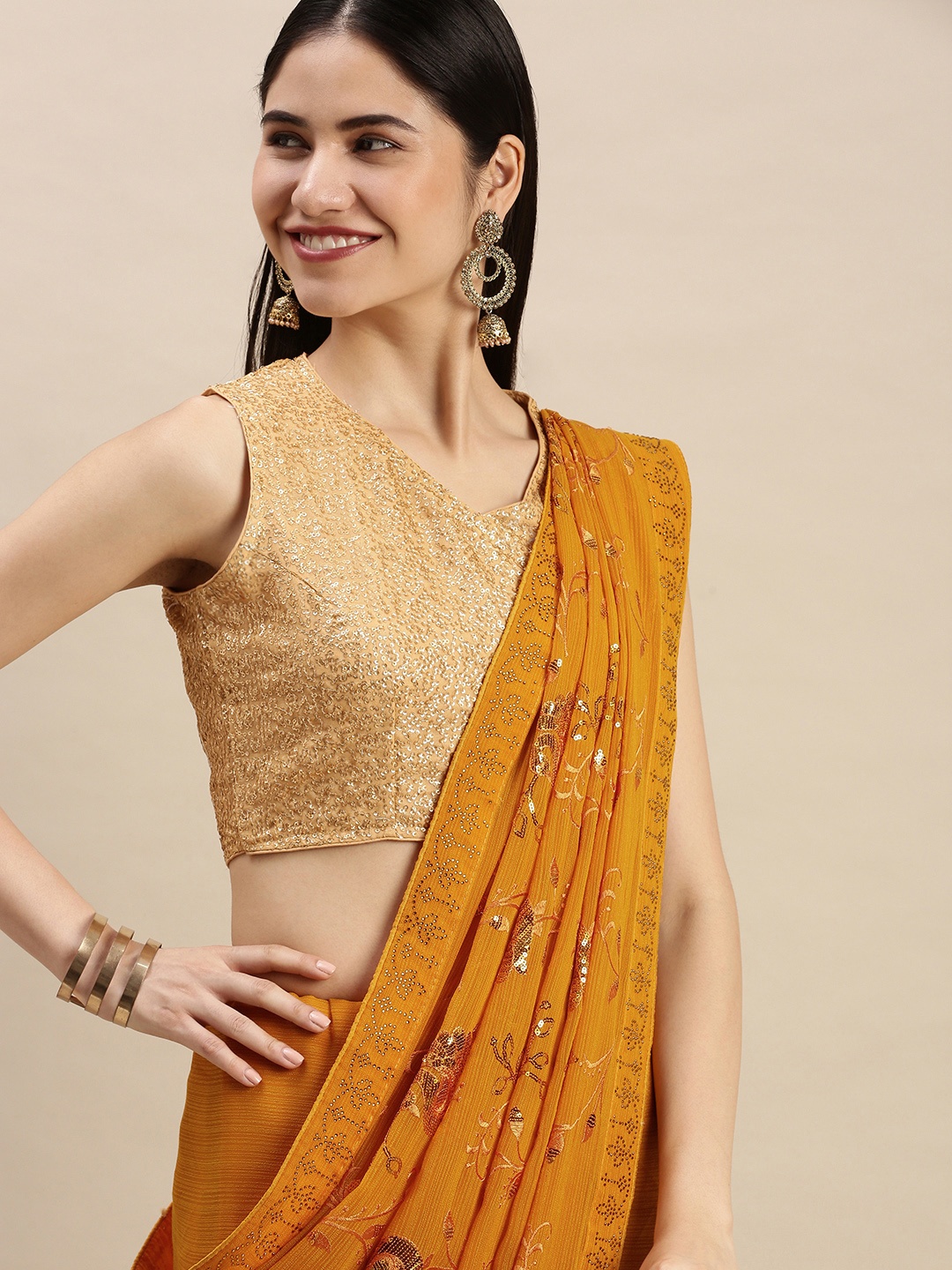 

Pothys Mustard Yellow Pure Chiffon Embellished Saree