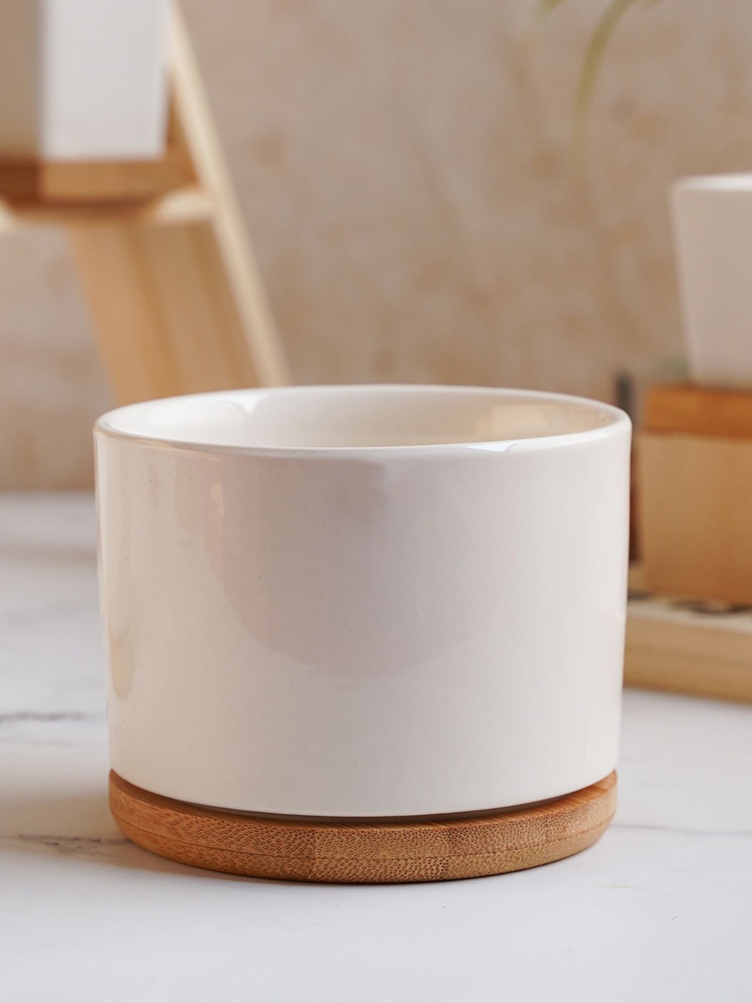 

Nestasia White Cylindrical Ceramic Planter