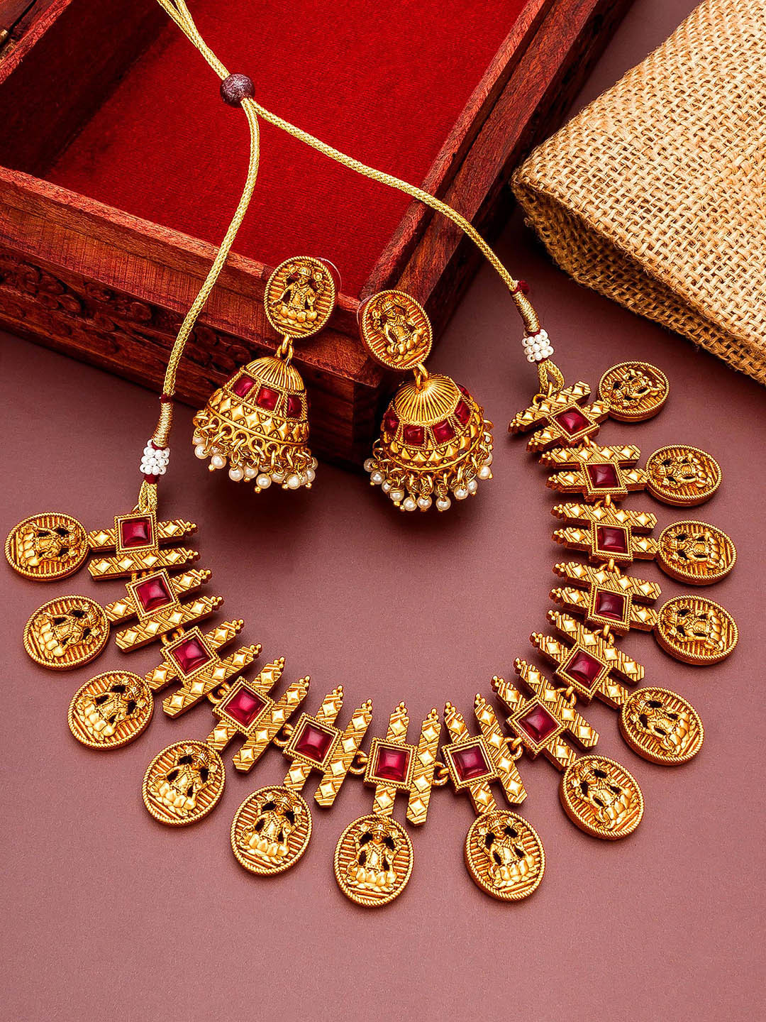 

aadita Gold-Plated Red stone Studded Pearl Beaded Temple Choker Jewellery Set