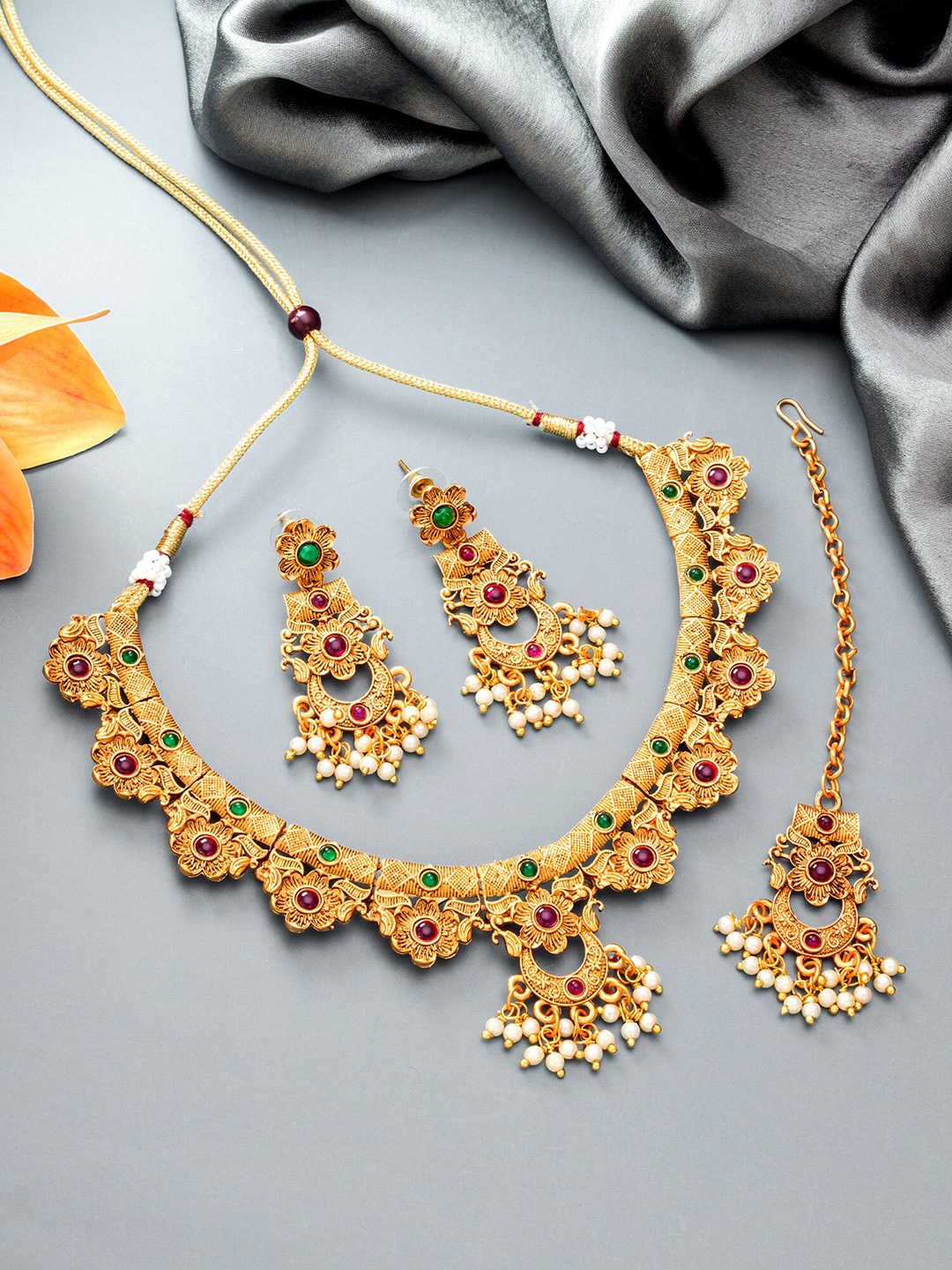 

aadita Gold-Plated White & Green Stone Studded & Beaded Jewellery Set