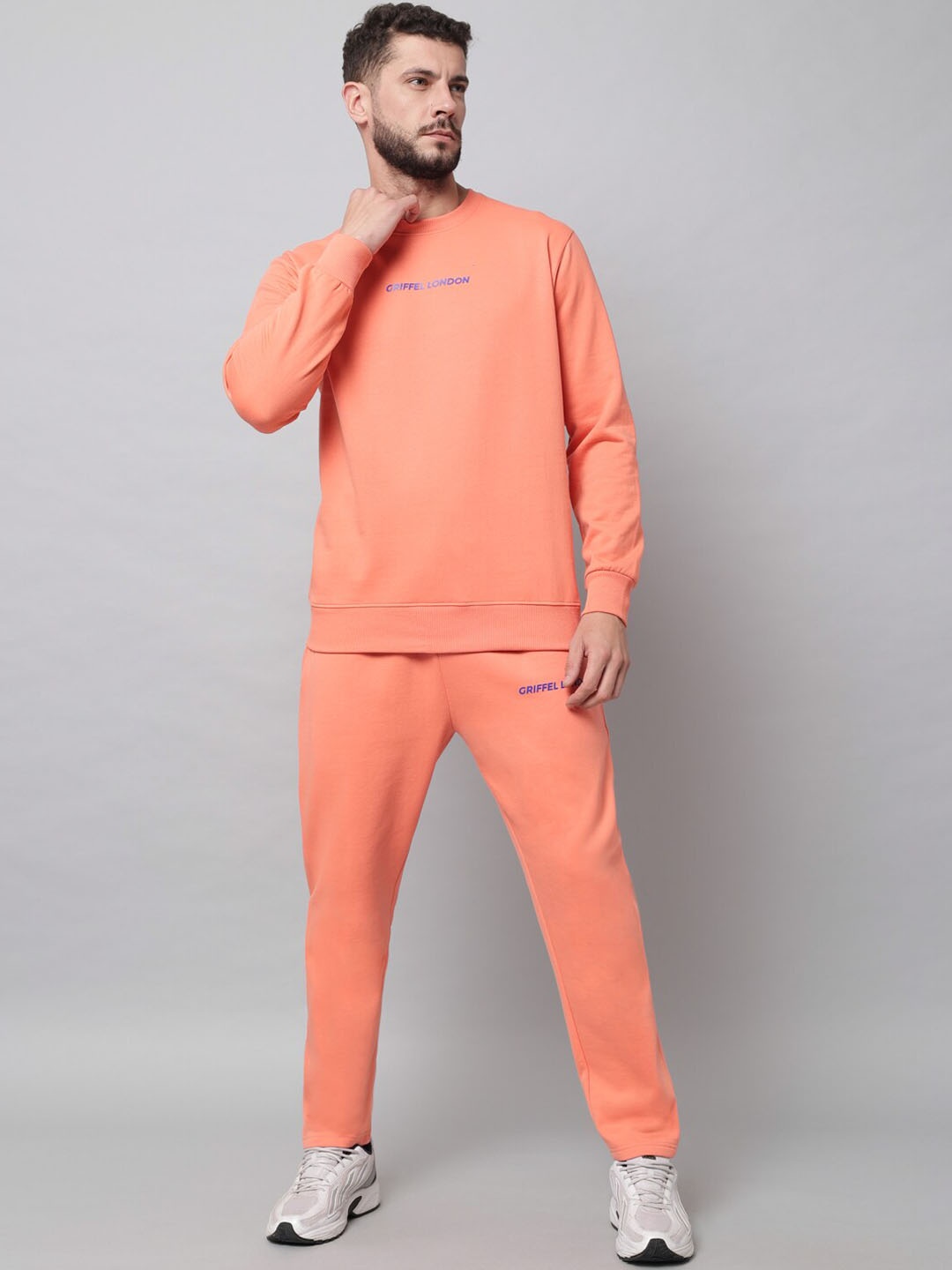 

GRIFFEL Men Peach Solid Tracksuits