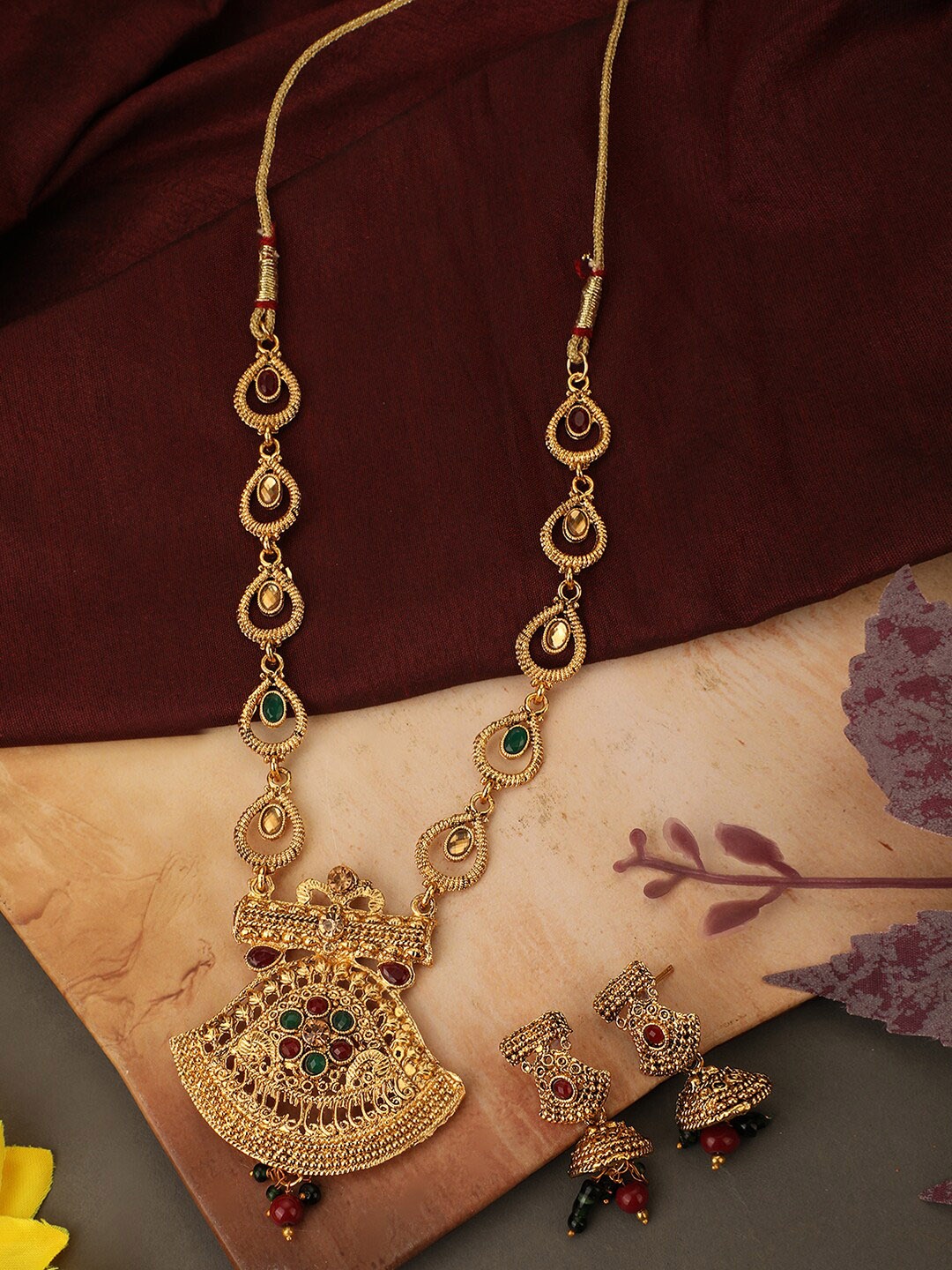 

ANIKAS CREATION Gold-Plated & Toned Maroon Artificial Stones and Beads Jewellery Set