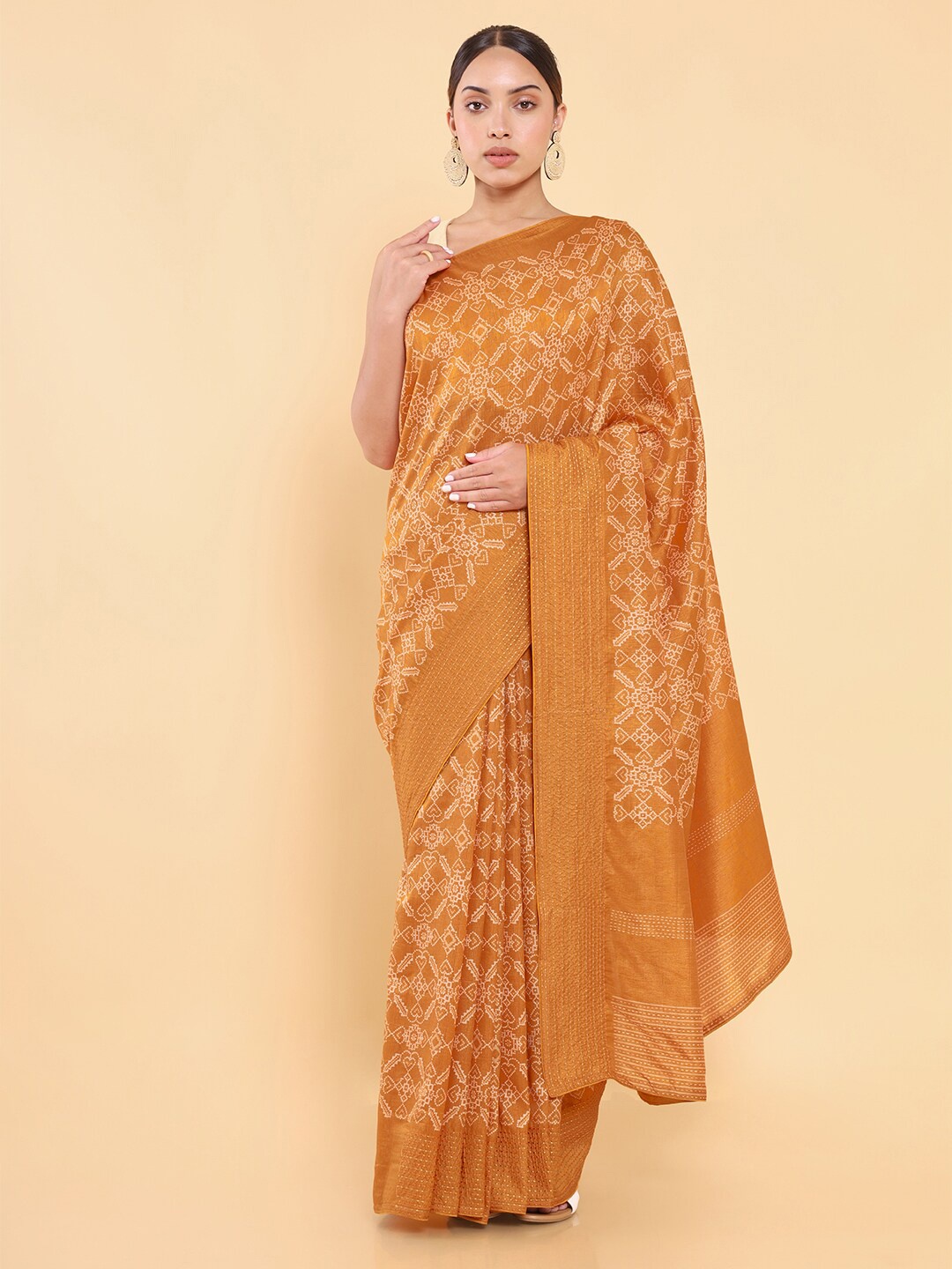 

Soch Gold-Toned & Off White Ethnic Motifs Saree