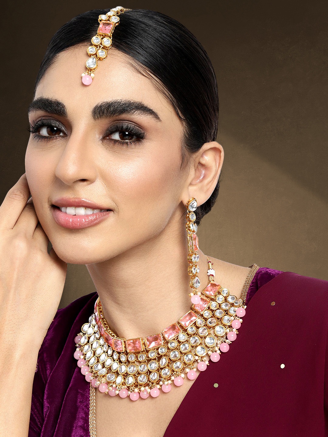

Peora Gold-Toned & Pink Beaded and Stone Studded Jadau Choker Jewellery Set