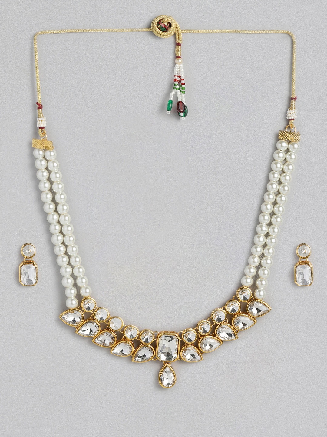 

Peora Off-White Gold-Plated Jadau Kundan Studded & Beaded Jewellery Set