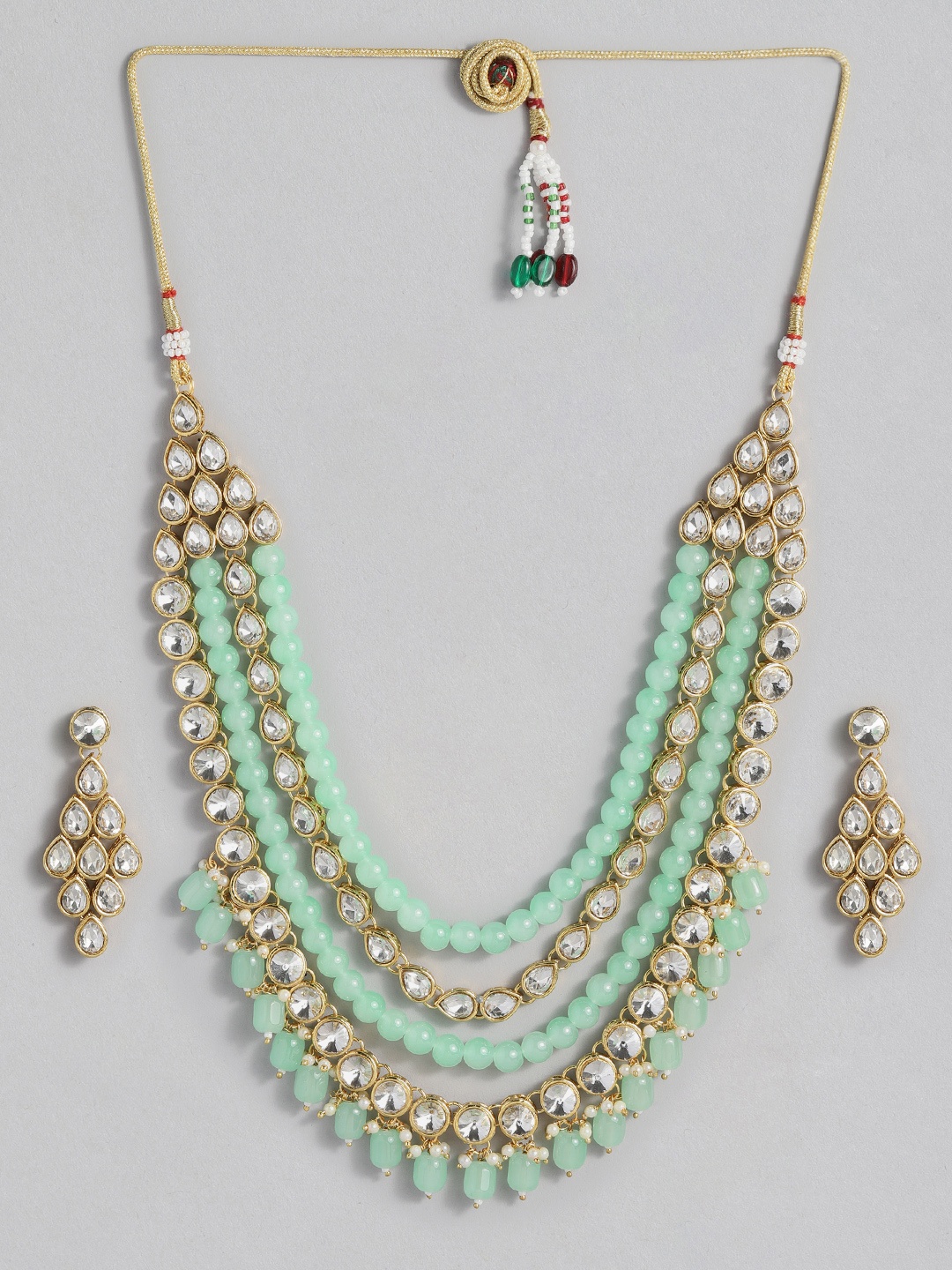 

Peora Sea Green Gold-Plated Kundan Studded Jewellery Set