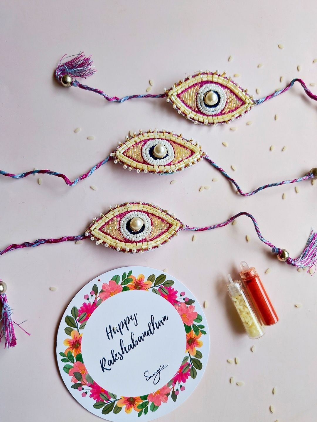 

Sangria Set Of 3 Rakhi With Roli Chawal & Greeting Card, Purple