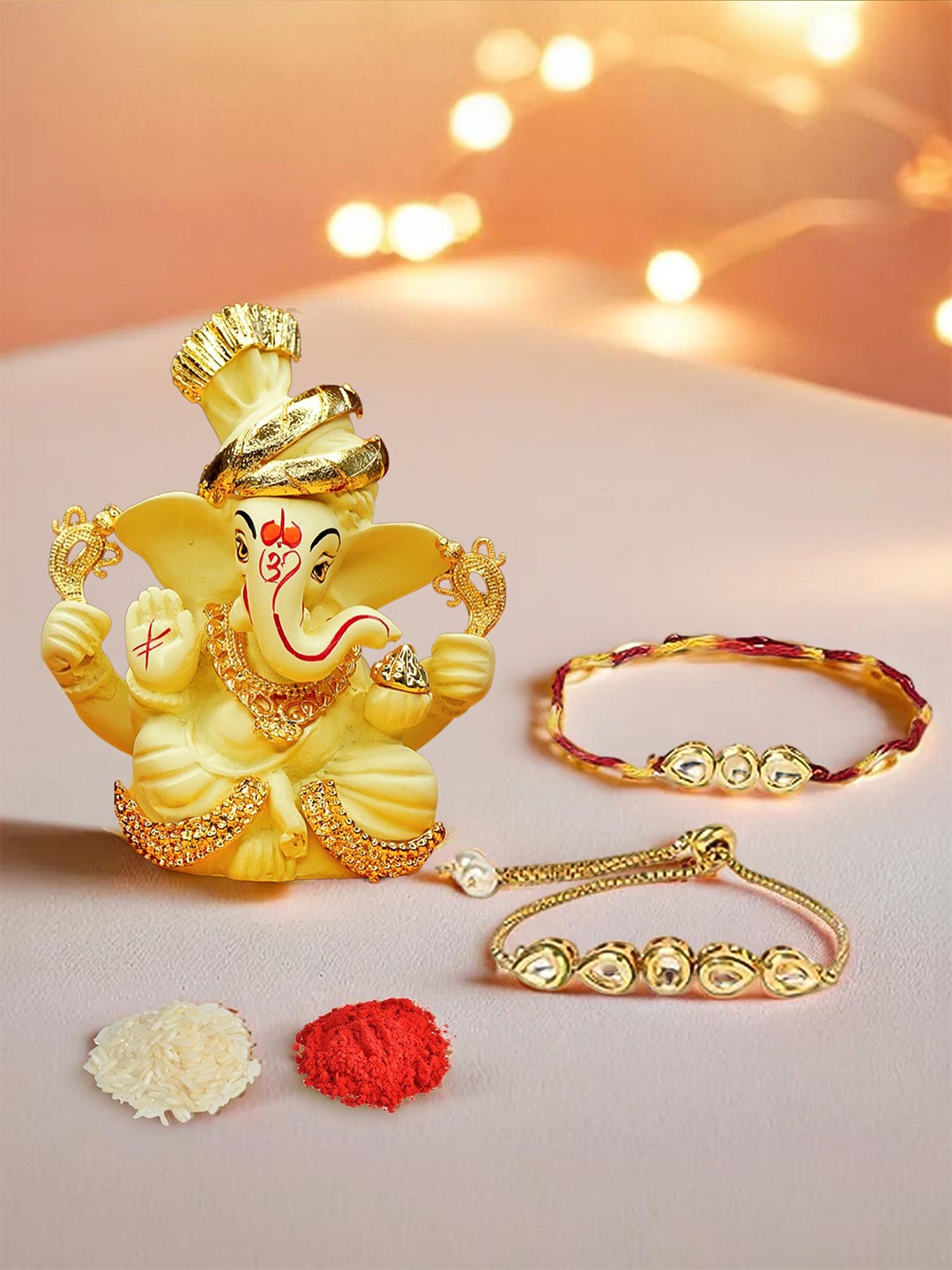 

Ekhasa Set Of 3 Rakhi With Ganesha Idol & Roli Chawal Rakhi, Yellow