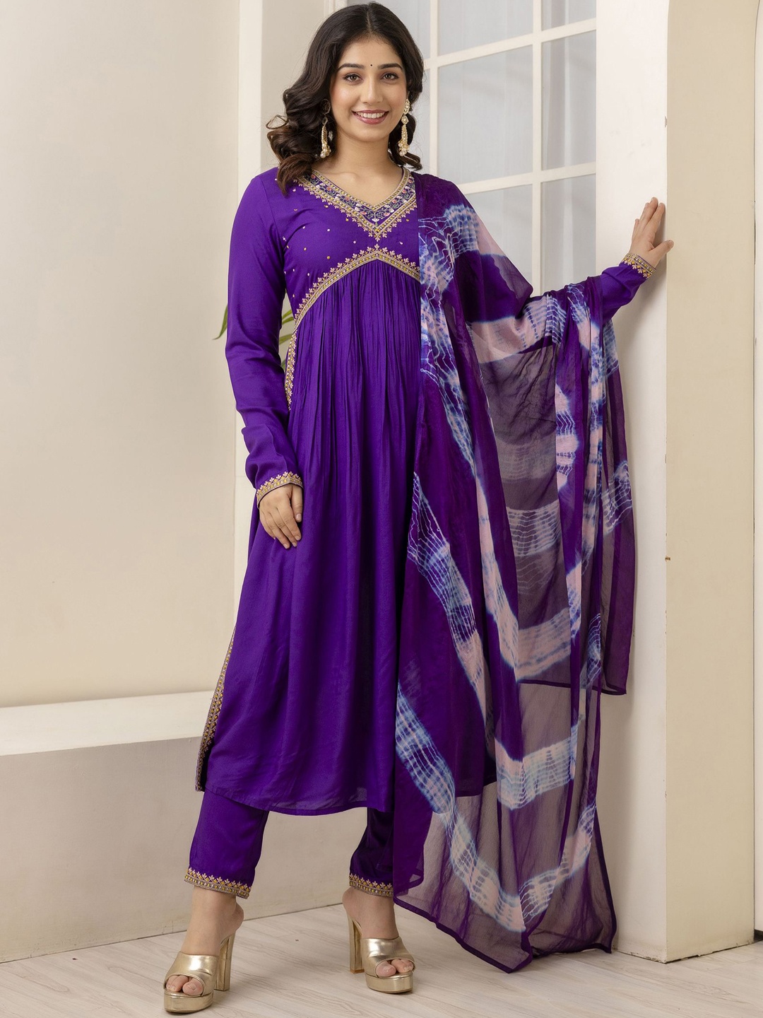 

Charu Ethnic Motifs Embroidered Empire Thread Work A-Line Kurta With Trousers & Dupatta, Purple