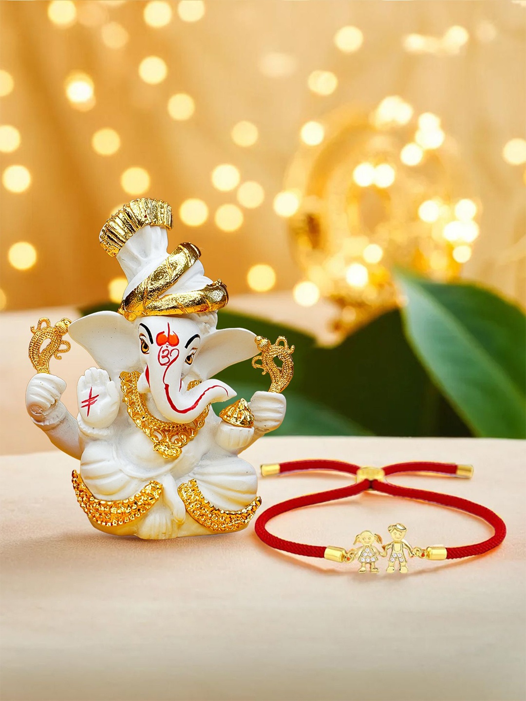 

Ekhasa Set Of 2 Stone Studded Brother Sister Rakhi With Ganesha Idol, Gold