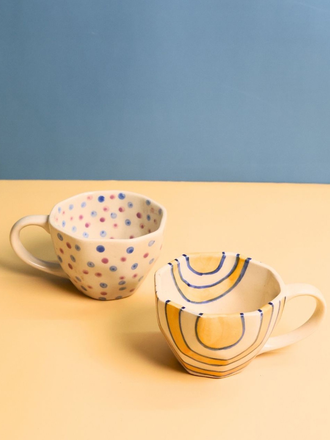 

WEAVING HOMES Purple & Mustard Yellow 2 Pieces Printed Ceramic Glossy Mugs