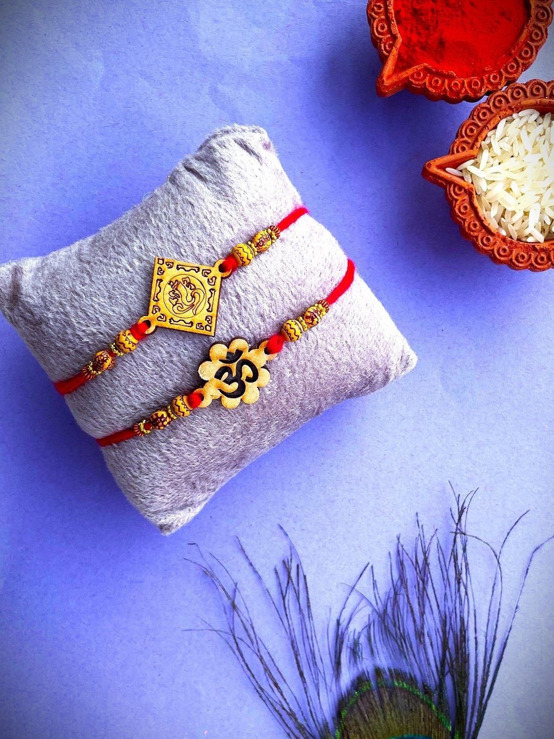 

Crunchy Fashion Set Of 2 Om Ganpati Beaded Thread Rakhis With Roli Chawal, Brown