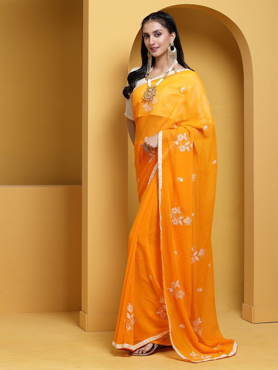

Somras Ethnic Motifs Embroidered Pure Georgette Yellow Saree