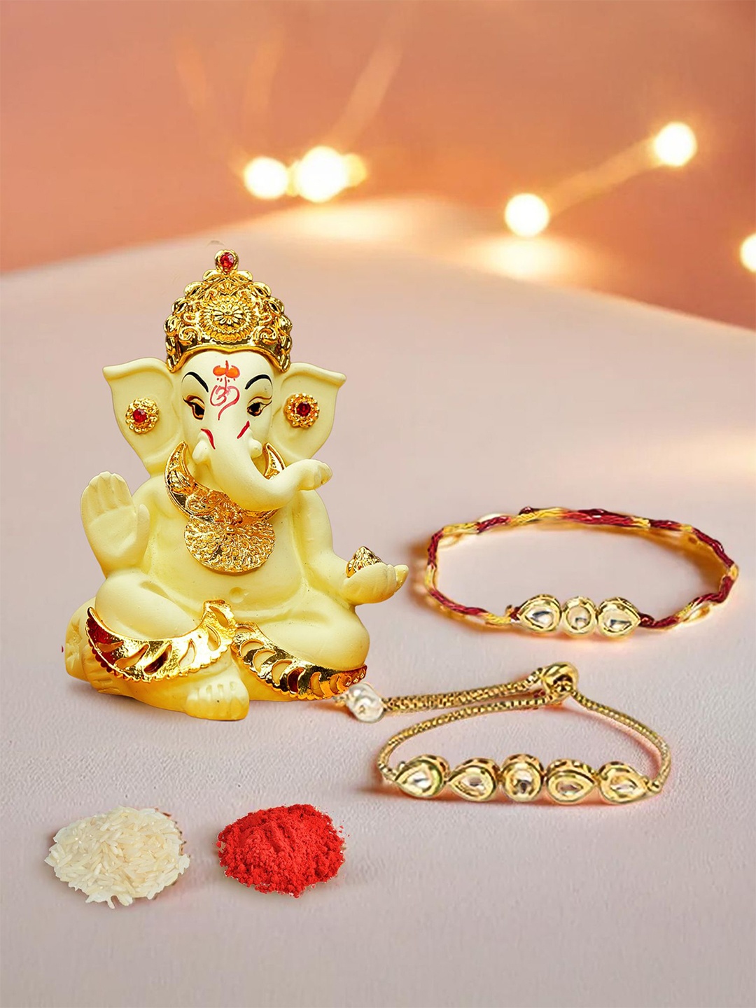 

Ekhasa Set Of 3 Kundan Studded Bhaiya Bhabhi Rakhi With Ganesha Idol, Yellow