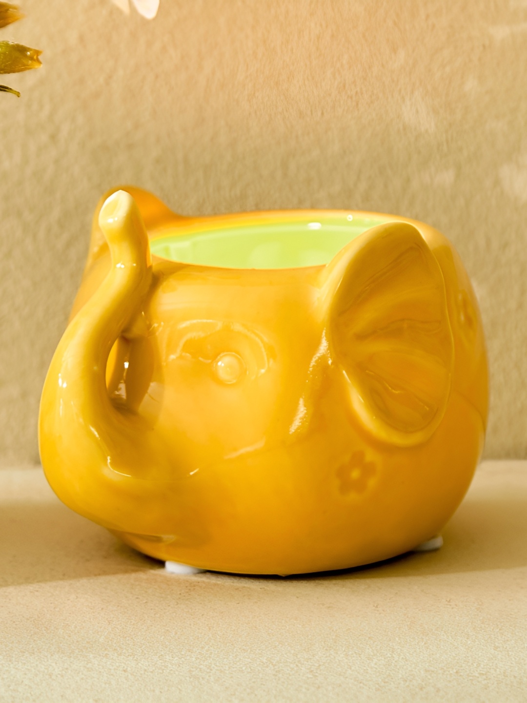 

Home Centre Yellow Ceramic Elephant Candle Holders