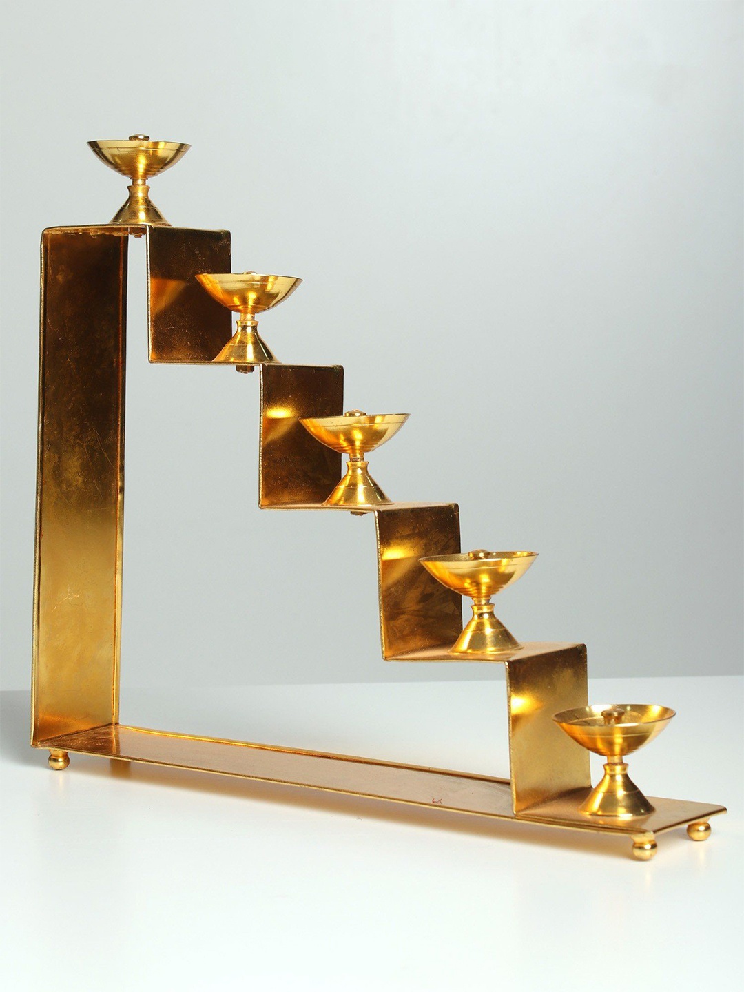 

Exotic India Brass Lamps on Five Steps Stair Stand, Gold