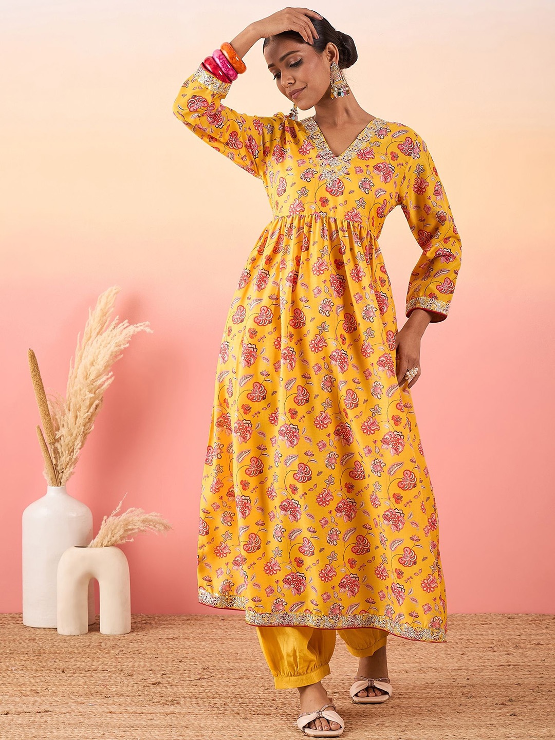 

Madhuni Women Floral Printed Angrakha Chanderi Silk Kurta with Trousers, Mustard