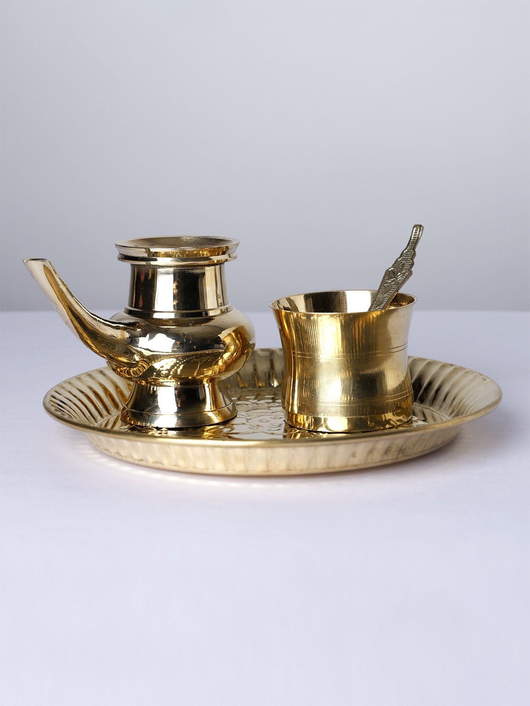 

Exotic India Set of Brass Puja Thali Ritual Puja Items, Gold