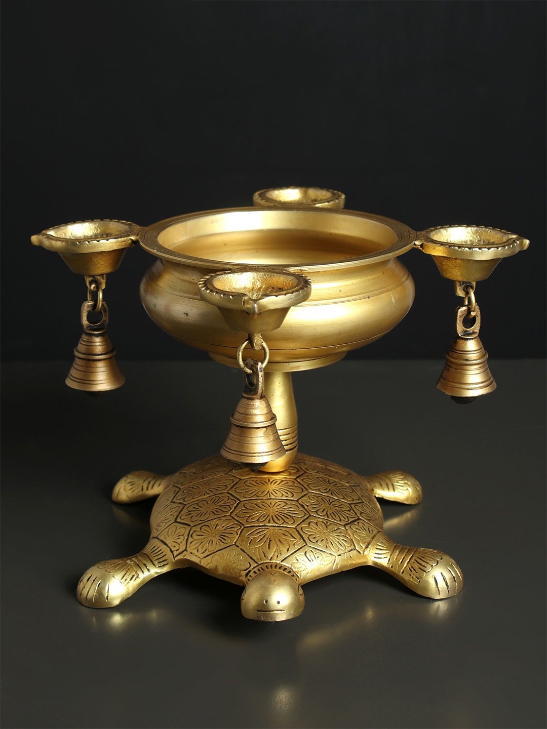 

Exotic India Brass Four Wicks Urli Lamp with Bells on Tortoise Back, Gold