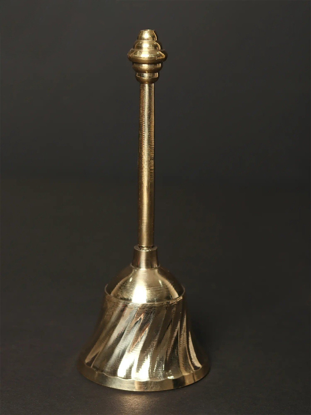 

Exotic India Puja Handheld Bell in Brass, Gold