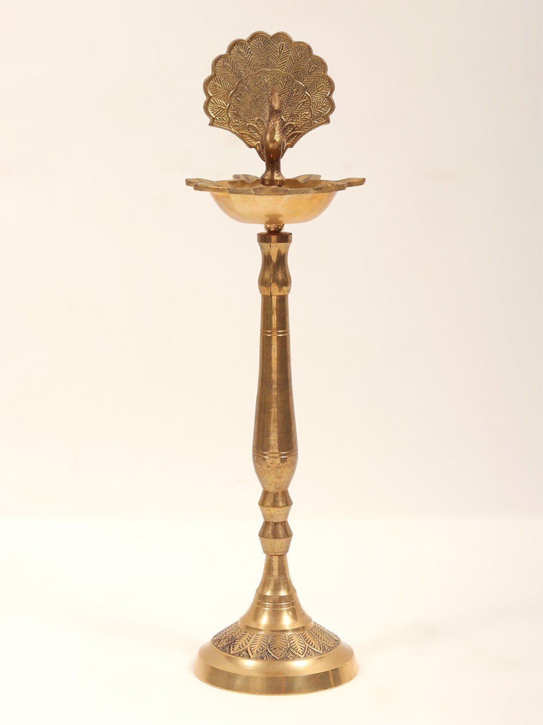 

Exotic India Seven Wicks Peacock Design Oil Lamp, Gold