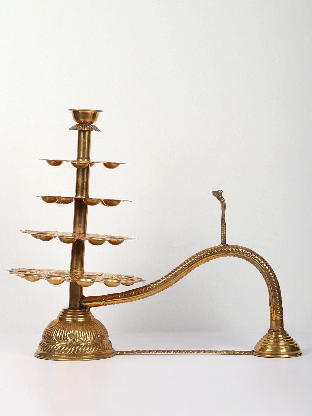 

Exotic India 4 Layer Handheld Multi Wick Aarti Lamp in Brass, Gold