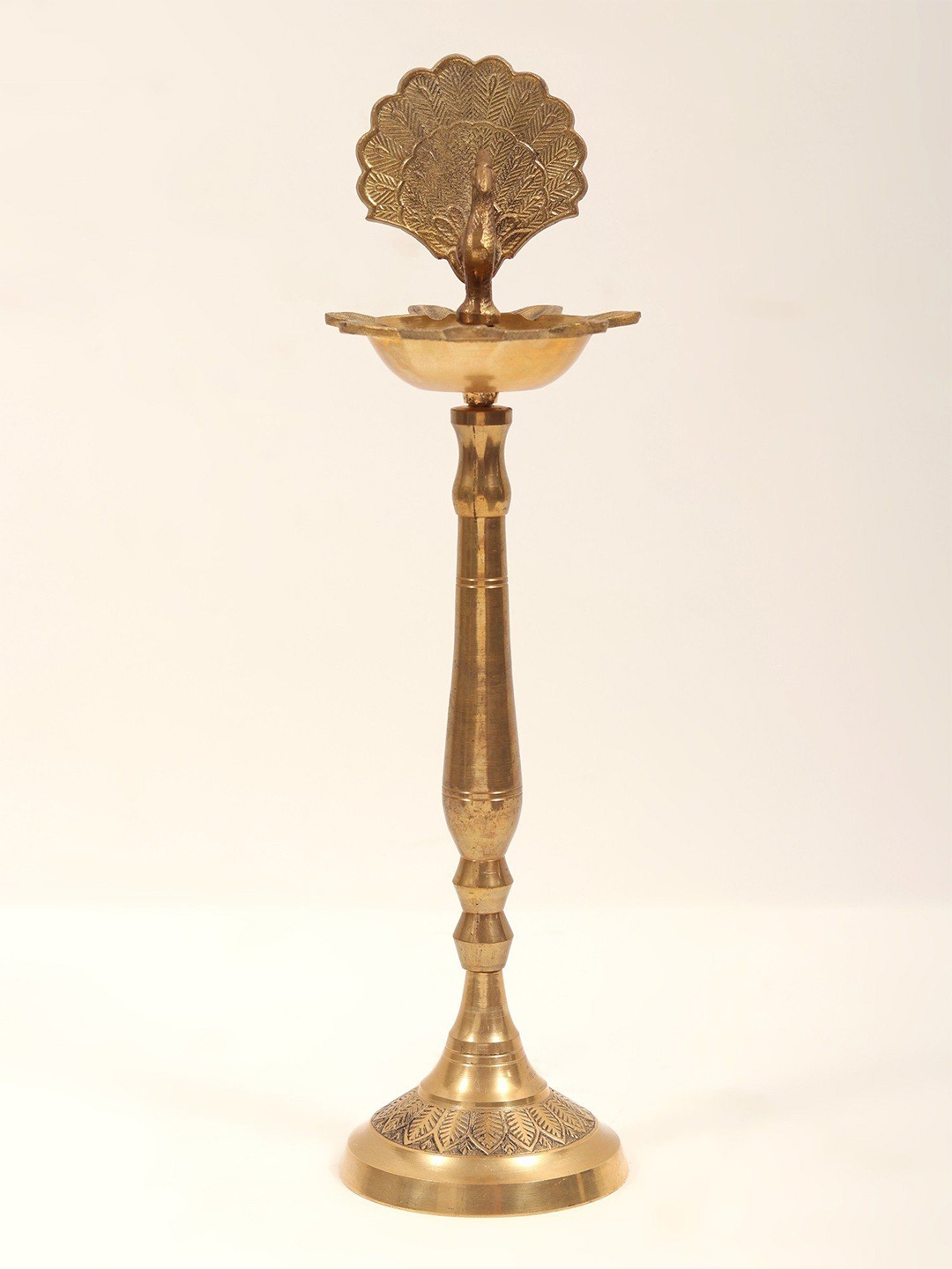 

Exotic India Brass Seven Wicks Peacock Design Lamp, Gold