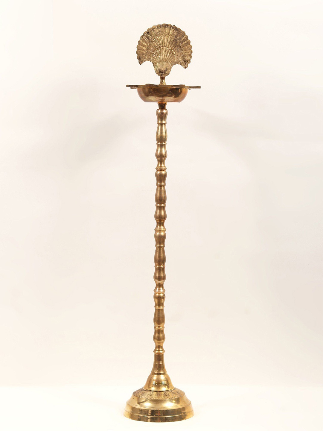 

Exotic India Brass Seven Wicks Peacock Design Lamp, Gold