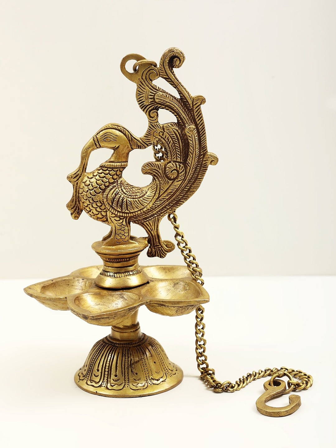 

Exotic India 10" Temple Hanging: Mayura Lamp In Brass, Gold