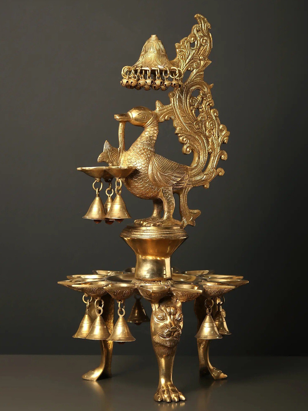 

Exotic India 25" Brass Peacock Lamp with Bells & Ghungroos, Gold