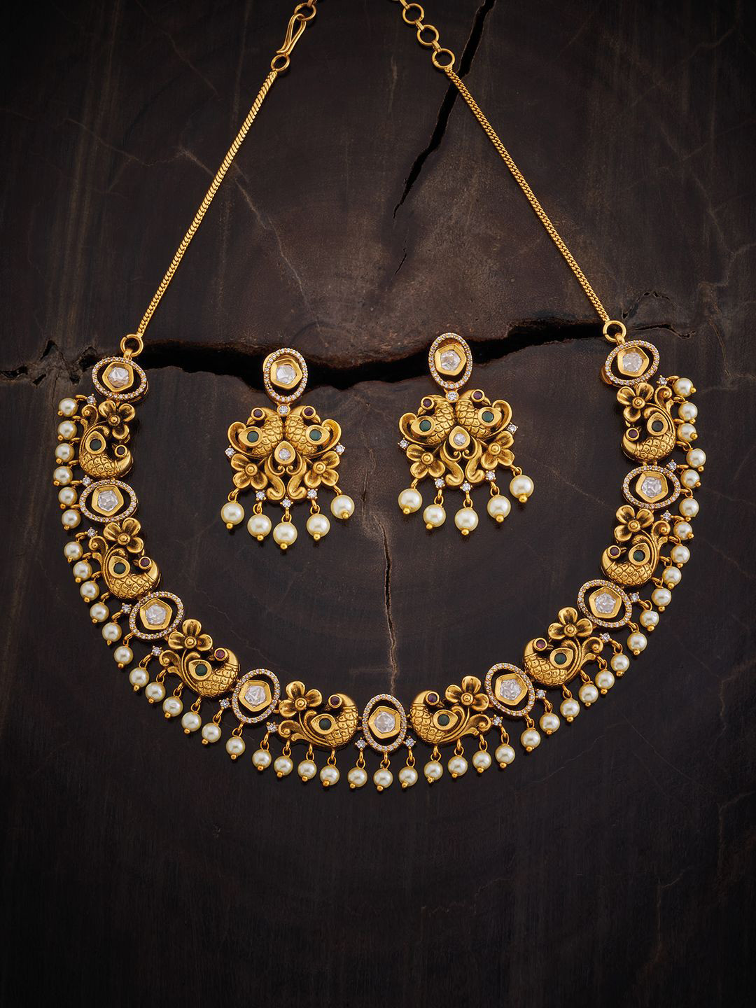 

Kushal's Fashion Jewellery Gold Plated Stone Studded & Beaded Antique Jewellery Set