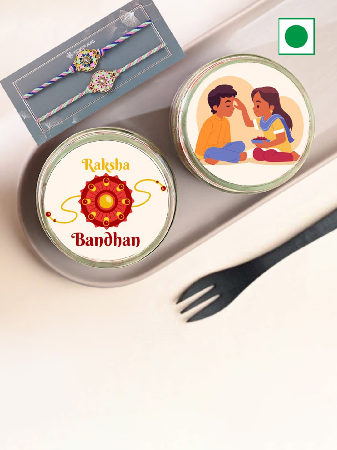 

Floweraura Set Of 2 Floral Rakhi With 2Pc Red Velvet Jar Cake Gift Set, Pink