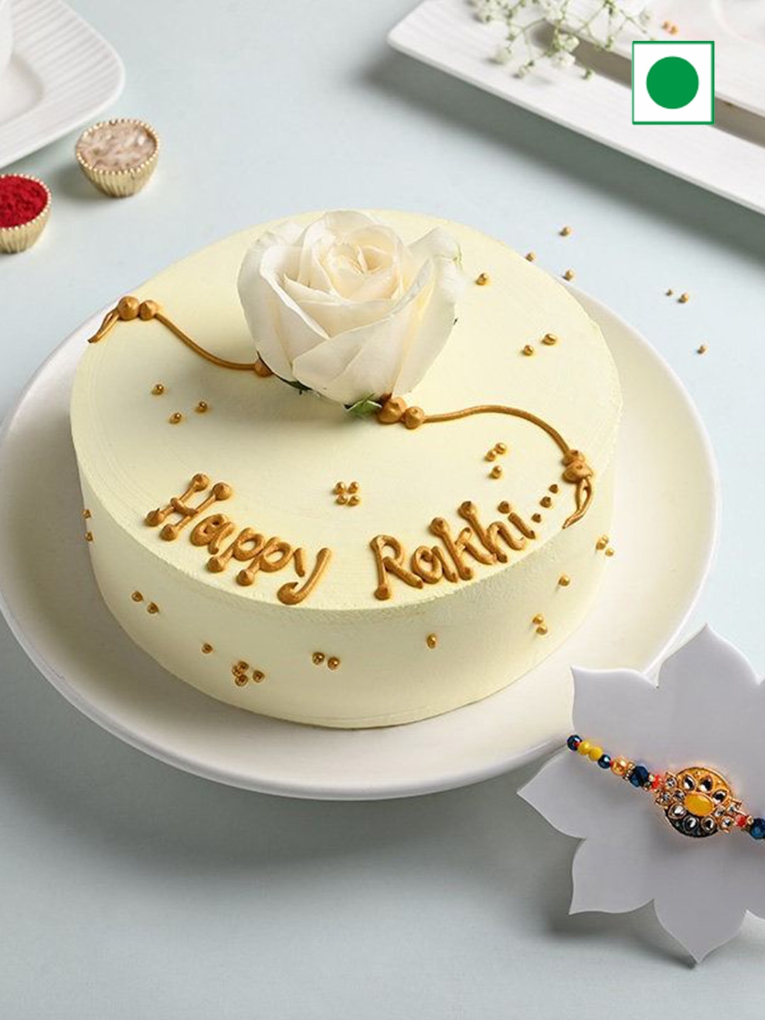 

Floweraura 2-Pcs Rakhis & Butterscotch Cake 0.5 Kg, Gold