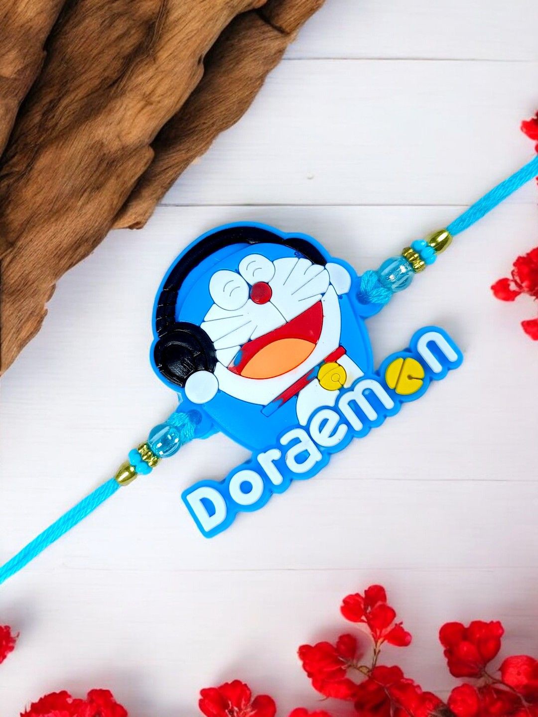 

ADIVA Doraemon Thread Rakhi With Roli Chawal & Card, Blue