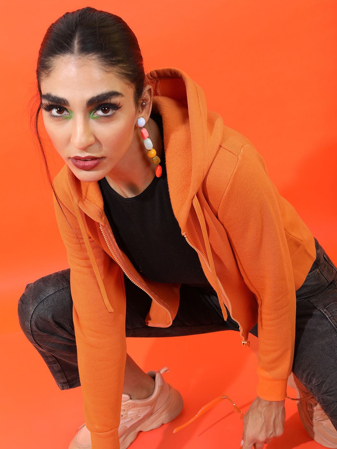 

Tokyo Talkies Women Solid Hooded Sweatshirt, Rust
