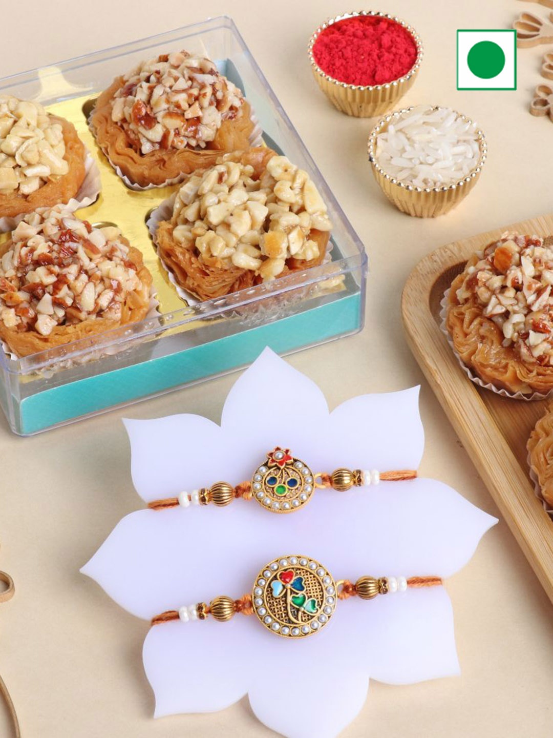 

Floweraura Set Of 2 Rakhi With Pack Of 4 Baklava Tart Sweet, Beige