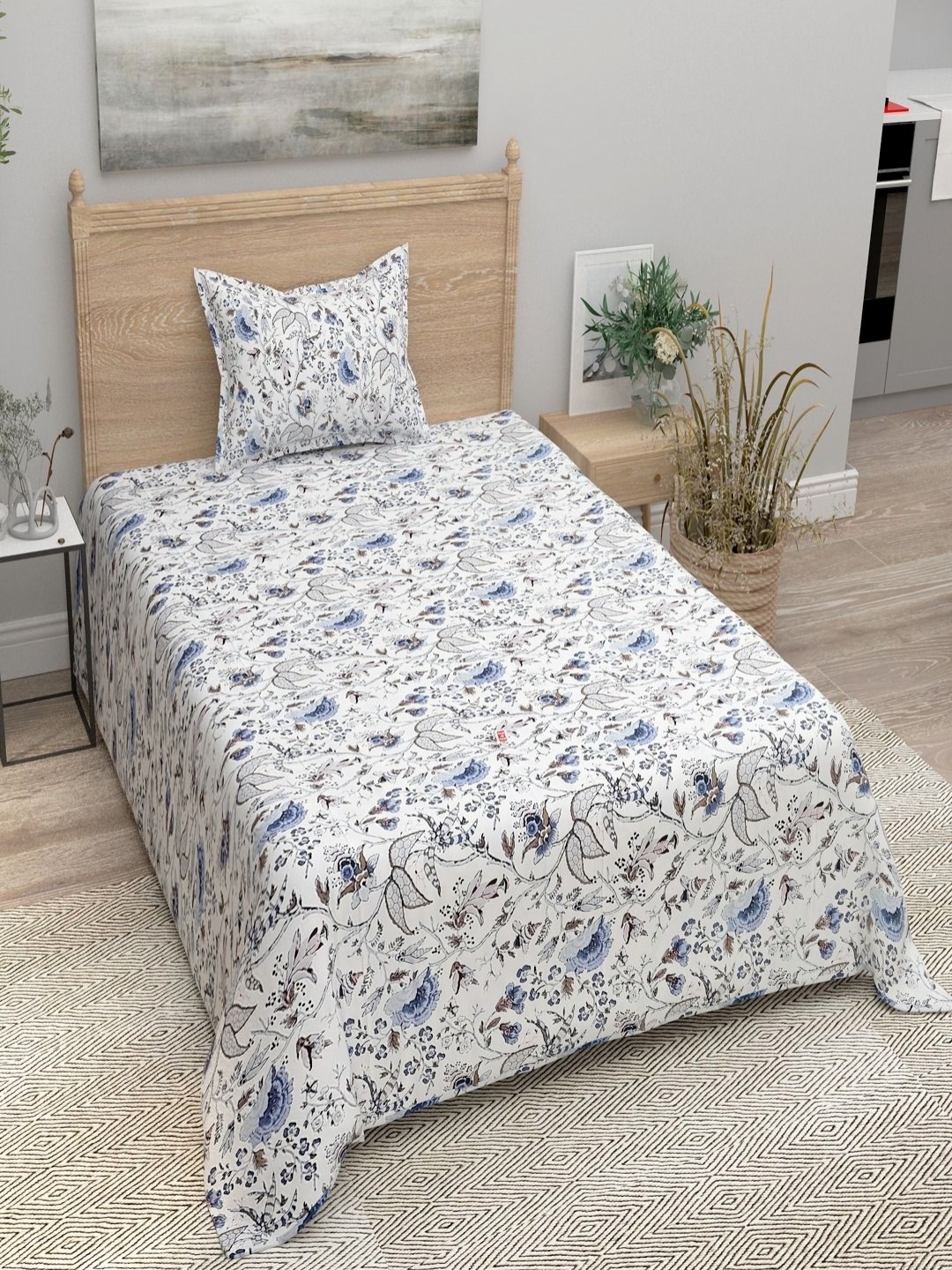

Aura Blue & White Floral 144 TC Single Bedsheet with 1 Pillow Covers
