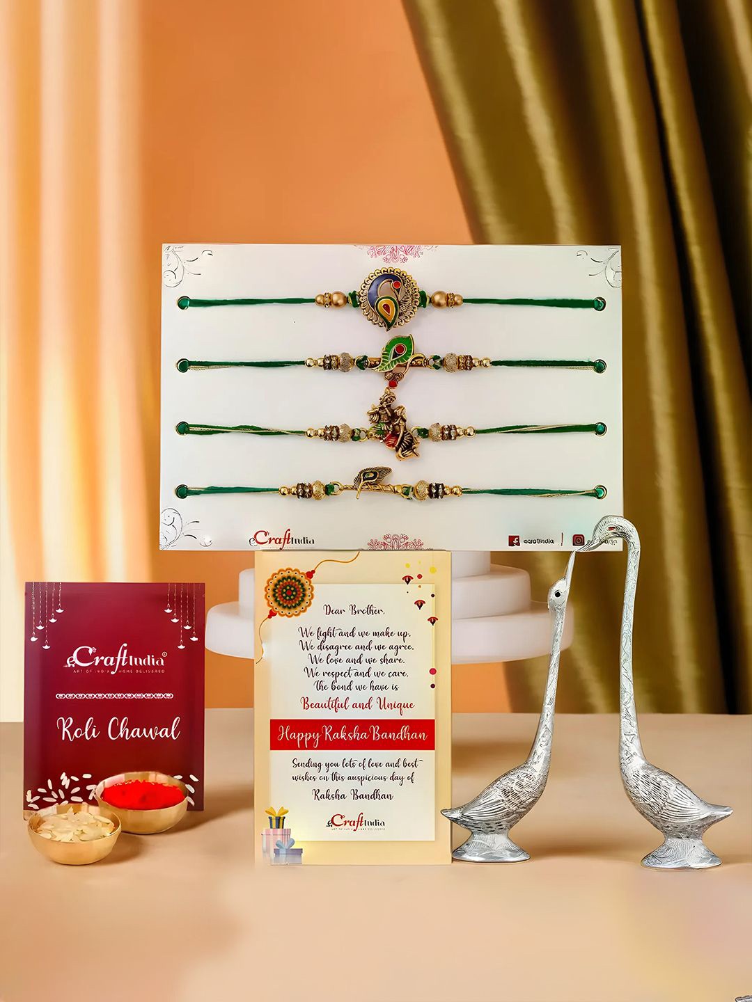 

eCraftIndia Set Of 6 Rakhis With Swan Statues & Roli Chawal, Gold