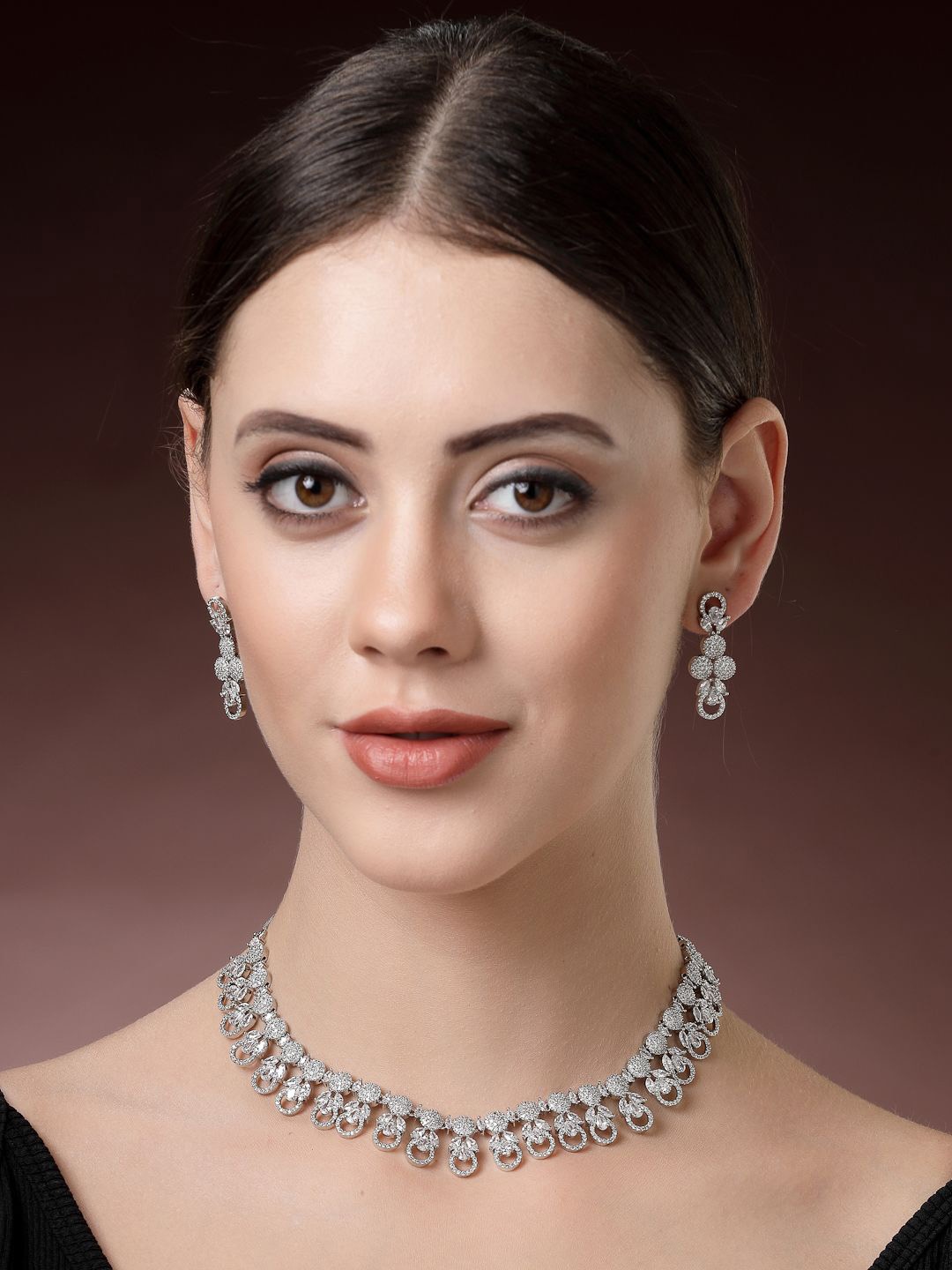 

ZENEME Rhodium-Plated American Diamond Studded Voguish Necklace and Earrings, Silver